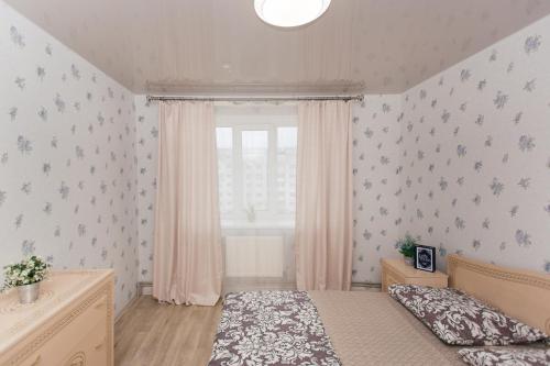 Ένα ή περισσότερα κρεβάτια σε δωμάτιο στο The Best Apartments Faraon on Kharkovskaya 2 room