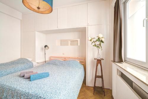 a bedroom with two beds and a window at The Grand Apartment. Center of Antwerp in Antwerp