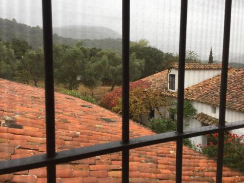 a view of the roofs of houses from a window at El Lucero in Alájar