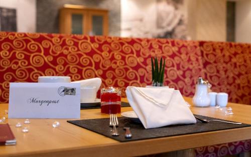 a table in a restaurant with a plate of food at ... mein romantisches Hotel Toalstock in Fiss