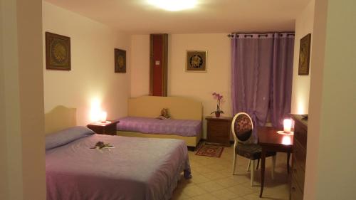 Ένα ή περισσότερα κρεβάτια σε δωμάτιο στο Affittacamere Villa Serafini