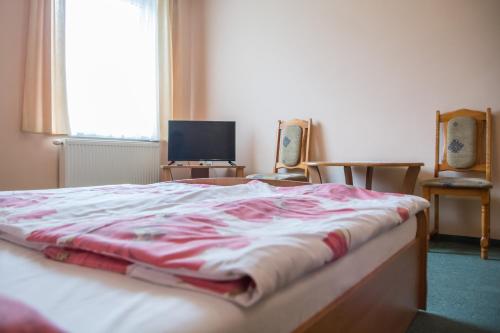 Zosienka - pokoje gościnne tesisinde bir odada yatak veya yataklar
