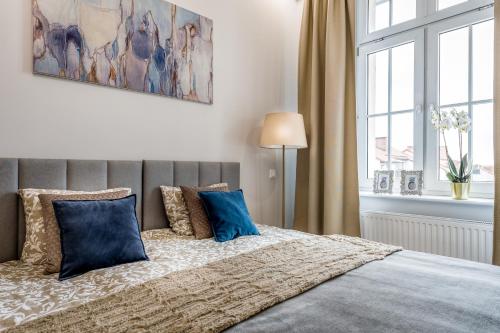 Posteľ alebo postele v izbe v ubytovaní Apartament Diamentowy
