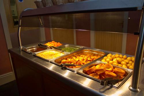 a buffet line with many different types of food at The Rutland Hotel in Douglas