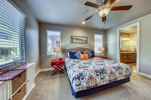 a bedroom with a bed and a ceiling fan at Splash Pad Place: Paradise Village #29 in Santa Clara