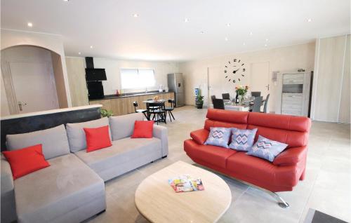 a living room with a couch and a table at Stunning Home In Monteux in Monteux