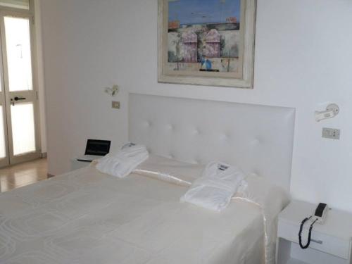 Postel nebo postele na pokoji v ubytování Hotel Diga