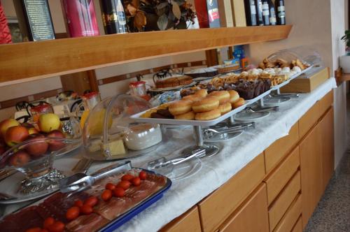 a buffet line with many different types of food at Hotel Diga in Marina di Ravenna