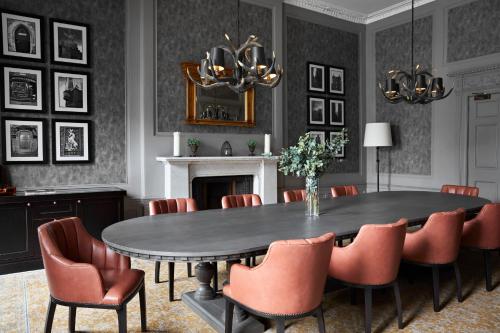 a dining room with a table and chairs at Kimpton Charlotte Square by IHG in Edinburgh