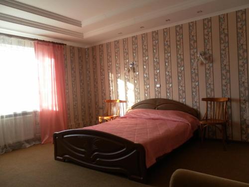 Voodi või voodid majutusasutuse Guest House Svoyaky toas