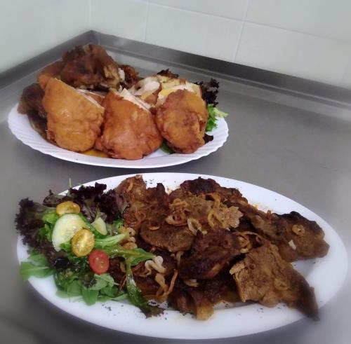 two plates of food sitting on a table at Jolán Pension & Restaurant in Číčov