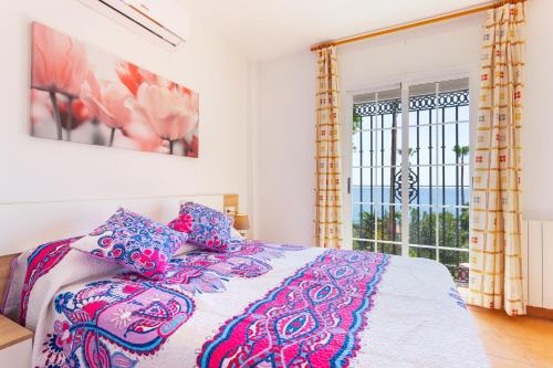 En eller flere senge i et værelse på Apartamento Ladera