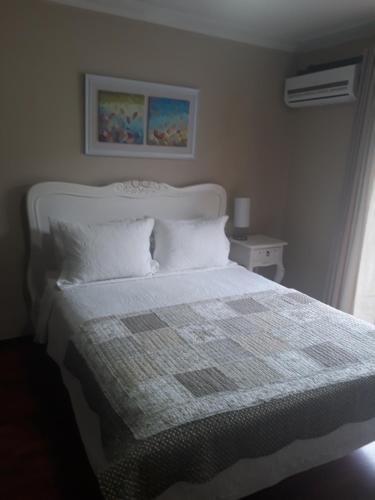 Ένα ή περισσότερα κρεβάτια σε δωμάτιο στο Hostal Pehuenche