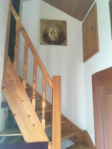 a picture of a mask hanging on a wall at Burgruine Schöllnstein in Iggensbach