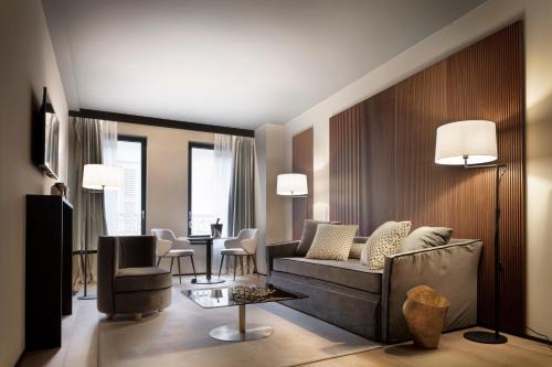 a living room with a couch and a table at Speronari Suites in Milan