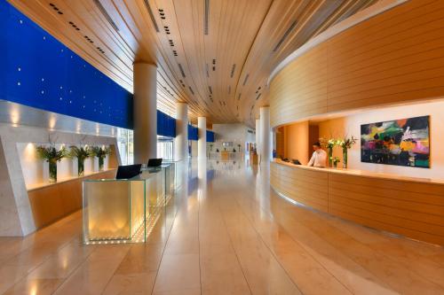 a lobby of a building with a long hallway at Kempinski Hotel Aqaba in Aqaba