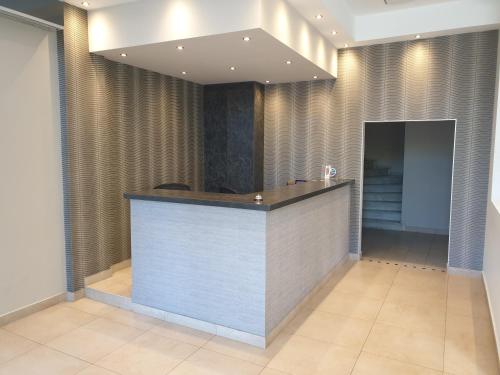 a lobby with a reception desk in a building at HOTEL HILL in Athens