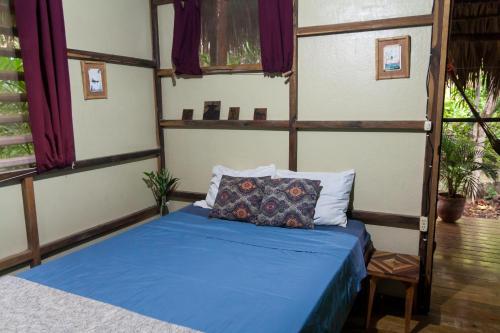 Ein Bett oder Betten in einem Zimmer der Unterkunft Hostel Clandestino Maderas