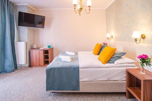 Łóżko lub łóżka w pokoju w obiekcie Pod Wzgórzem Bed & Breakfast