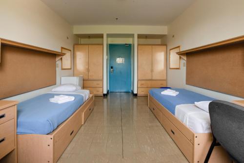 Säng eller sängar i ett rum på University of King's College
