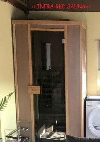 a glass door of a building with a staircase at Liveza House in Miklavž pri Ormožu