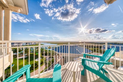 a balcony with two chairs and a view of the ocean at Margaritaville Resort Orlando in Orlando