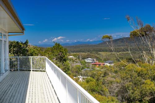 a balcony of a house with a view at La Mer, 19 Dulconghi Street in Crescent Head
