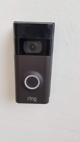 a black fire camera sitting on a wall at Cottage Grove Homestay rooms in Portsmouth