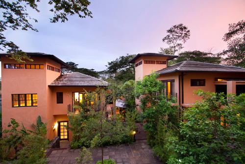 a large house with a garden in front of it at Jet Luxury at Langosta Beach Resort & Villas in Tamarindo