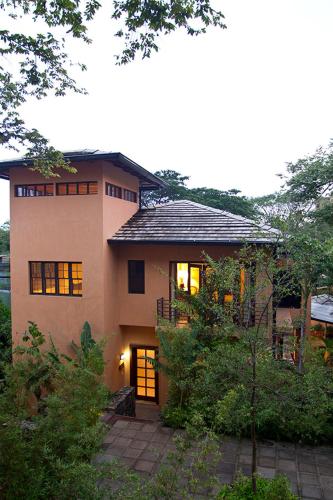 a large house with a lot of windows at Jet Luxury at Langosta Beach Resort & Villas in Tamarindo