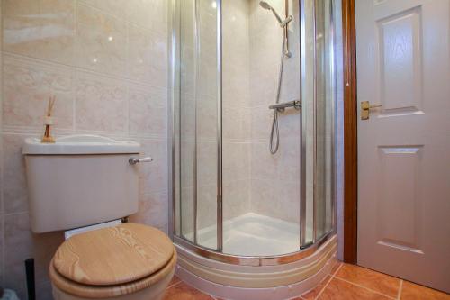 a bathroom with a shower with a toilet and a toilet at Foxhill Fold in Gisburn