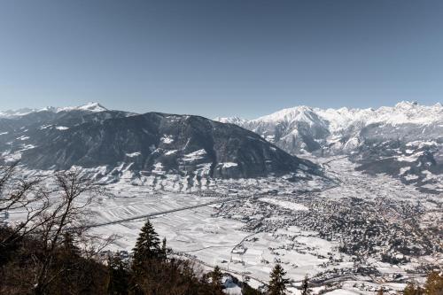 an aerial view of a town in the mountains at Miramonti Boutique Hotel in Avelengo