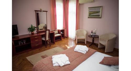 Кровать или кровати в номере Garni Hotel Vila Milord Resort