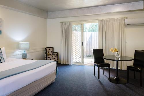 Posteľ alebo postele v izbe v ubytovaní Fairways Resort