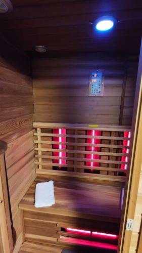 a small sauna with a white towel in it at Vivere in Houthalen-Helchteren