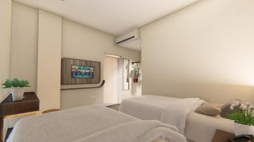 Ένα ή περισσότερα κρεβάτια σε δωμάτιο στο Hotel 88 Alun Alun Bandung By WH