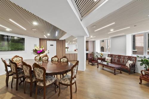 a dining room with a table and chairs at YEHS Hotel Sydney QVB in Sydney