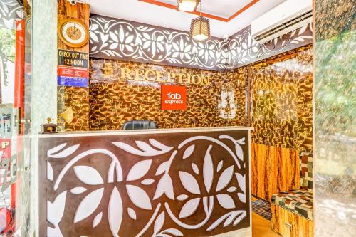 a room with a partition with a sign on it at FabHotel Gazal Residency Mahanagar in Lucknow