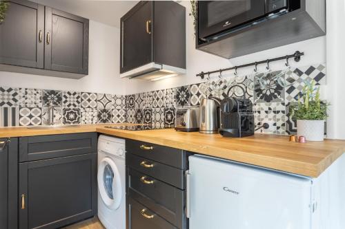 Una cocina o zona de cocina en Le Grand Parilly