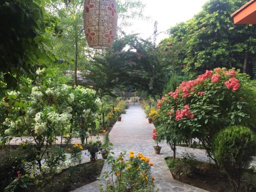a garden filled with lots of plants and flowers at Chautari Garden Resort in Sauraha