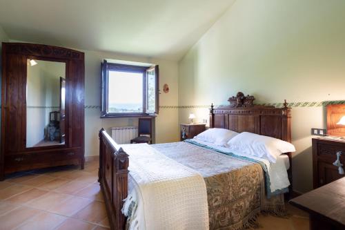 Ένα ή περισσότερα κρεβάτια σε δωμάτιο στο Cottage l'Assiolo