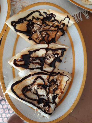 a plate with three desserts on a table at Ethno House Kosic in Herceg-Novi