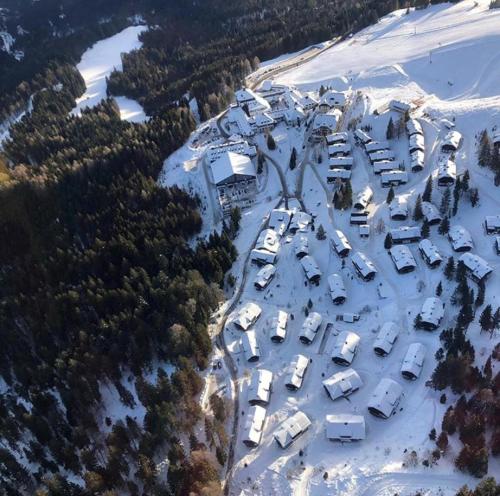 an aerial view of a parking lot with cars in the snow at Sonnleitn 29 in Sonnenalpe Nassfeld