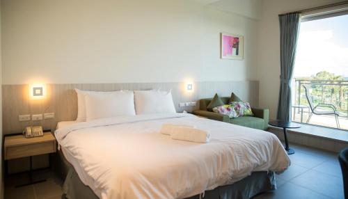 Cama o camas de una habitación en 墾丁椰林 海灘文旅