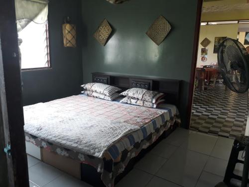 a bedroom with a bed in a room at Mulu D cave homestay in Mulu