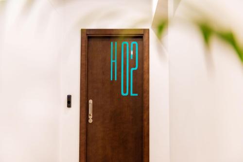 a door with the hp sign on it at TAKE SURF Hostel Conil in Conil de la Frontera