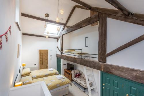 a room with a loft with a bunk bed at Airton Mill in Airton