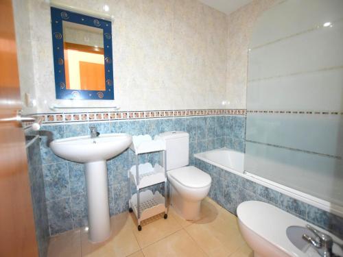 a bathroom with a sink and a toilet and a shower at Apartamento Benvinguts I in Jávea