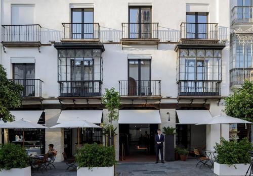 a building with two windows and a balcony at EME Catedral Hotel in Seville