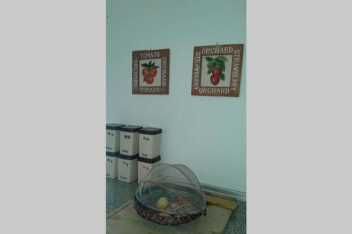 a room with a basket of food on a table at Palheirinho in Zimbreira
